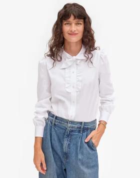A woman wearing clare v white cotton oxford pia blouse
