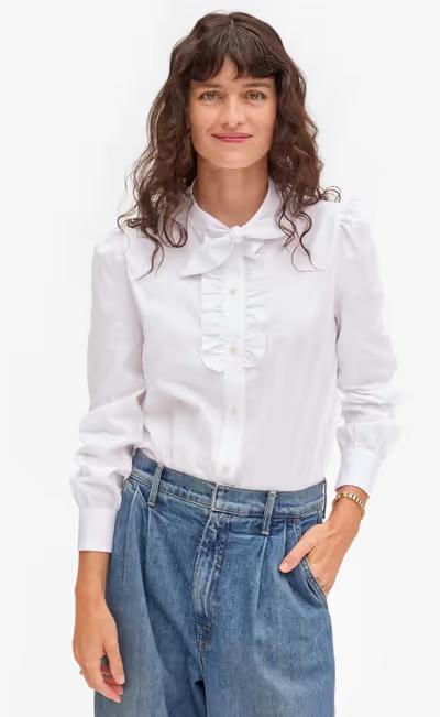 A woman wearing clare v white cotton oxford pia blouse