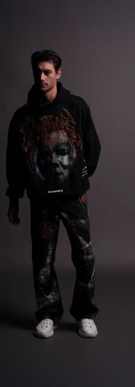 A man wearing Darc Sport​ it's time "Pierce" hoodie in black