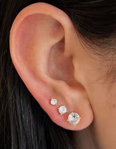 A woman wearing Evry Jewels ice ice baby earrings