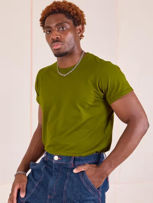 A man wearing Big Bud Press the organic vintage tee - summer olive