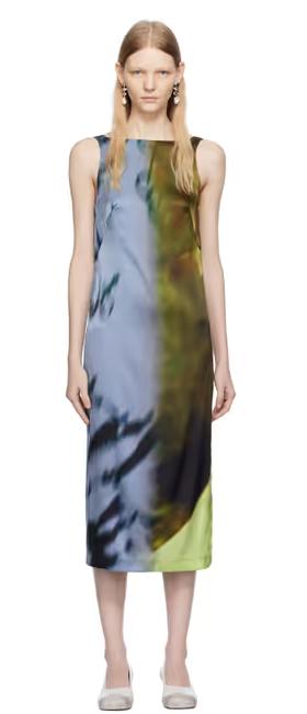 A woman wearing Serapis blue & khaki open back midi dress