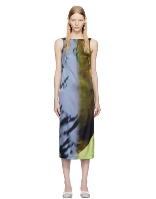 A woman wearing Serapis blue & khaki open back midi dress