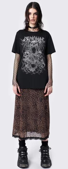 A woman wearing minga london​ demoniac black graphic t-shirt