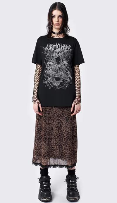 A woman wearing minga london​ demoniac black graphic t-shirt
