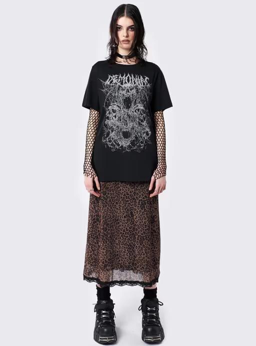 A woman wearing minga london​ demoniac black graphic t-shirt