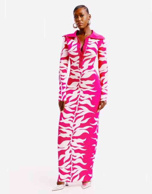 A woman wearing Hanifa fuchsia and white soraya maxi