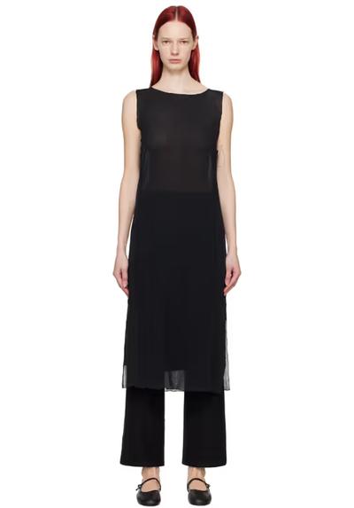 A woman wearing Youth black lettuce edge midi dress