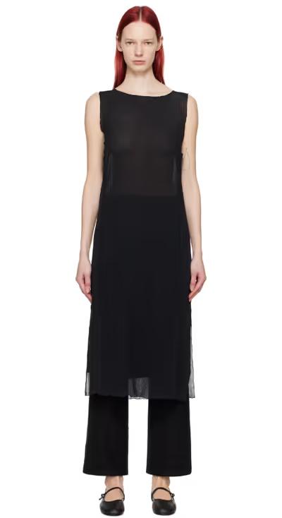 A woman wearing Youth black lettuce edge midi dress