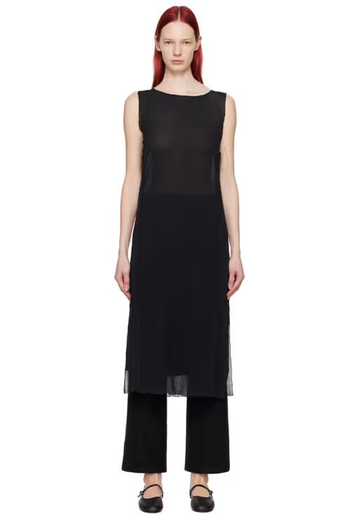 A woman wearing Youth black lettuce edge midi dress