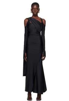 A woman wearing SRVC black siren maxi dress
