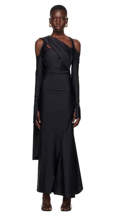 A woman wearing SRVC black siren maxi dress