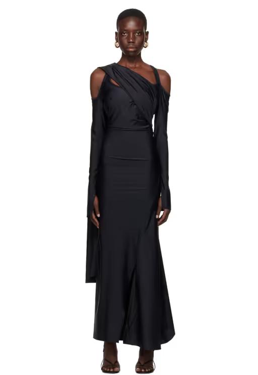 A woman wearing SRVC black siren maxi dress
