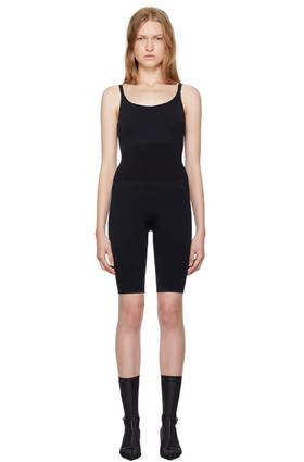 A woman wearing Swedish Stockings black rita jumpsuit