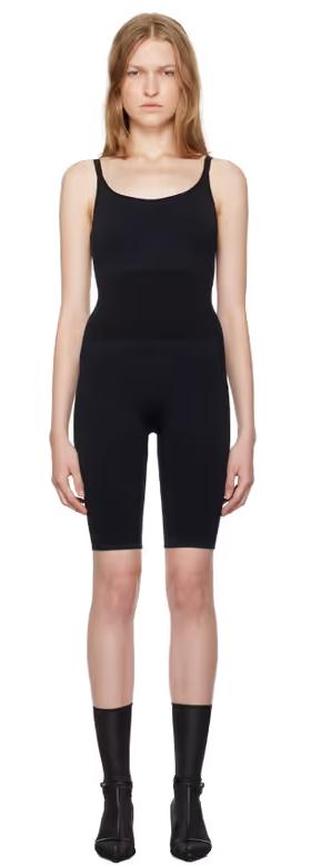A woman wearing Swedish Stockings black rita jumpsuit