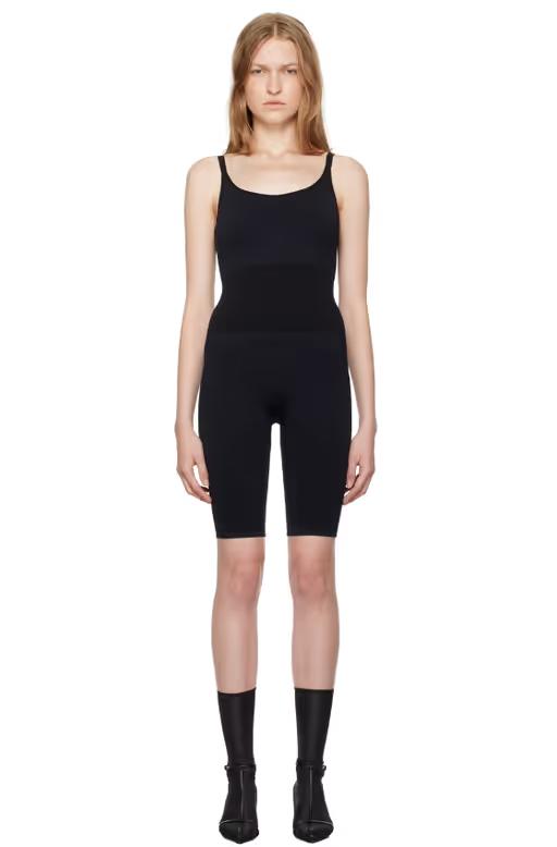 A woman wearing Swedish Stockings black rita jumpsuit
