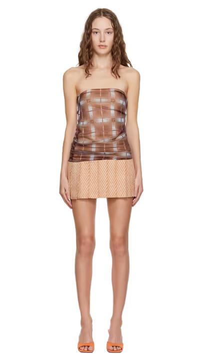 A woman wearing Sultry Virgin brown check strapless minidress