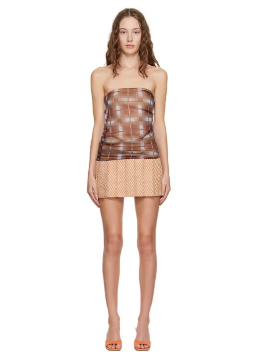 A woman wearing Sultry Virgin brown check strapless minidress
