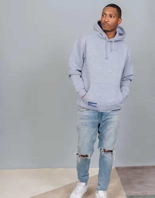 A man wearing SERHANT. heather grey hoodie