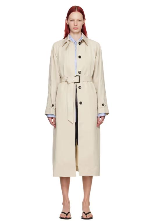 A woman wearing Teurn Studios beige belted trench coat
