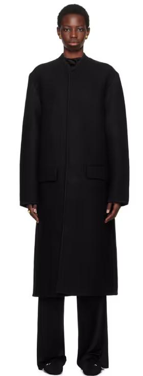 A woman wearing Rier black walker coat
