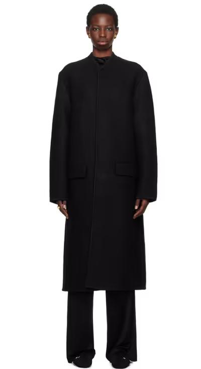 A woman wearing Rier black walker coat