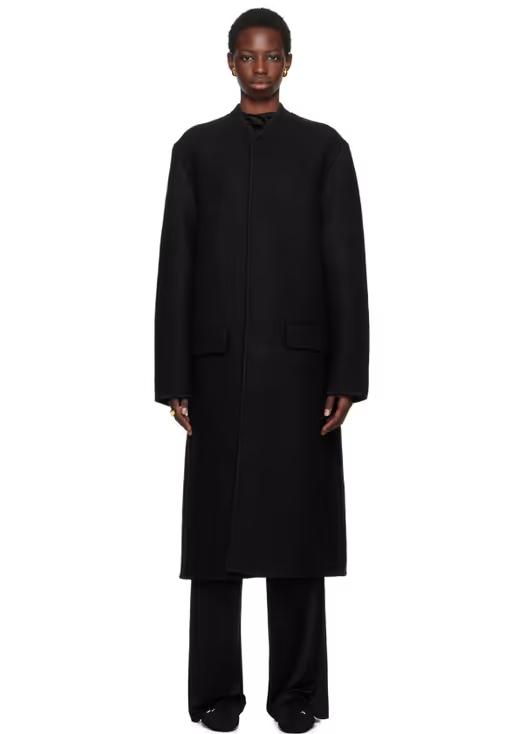 A woman wearing Rier black walker coat