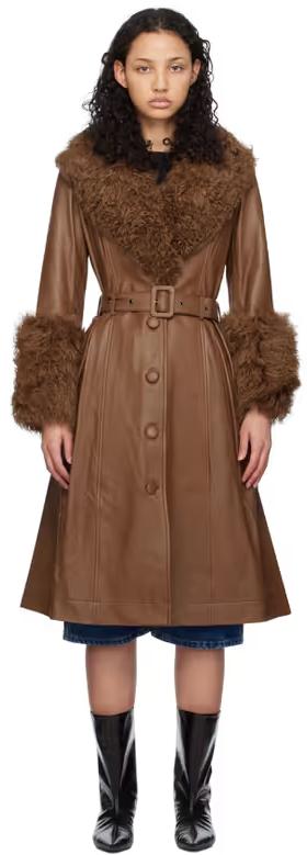 A woman wearing Saks Potts brown foxy shearling coat