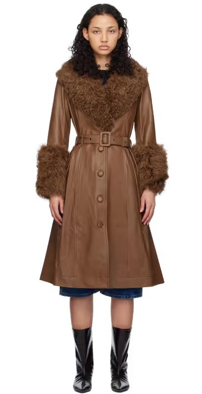 A woman wearing Saks Potts brown foxy shearling coat
