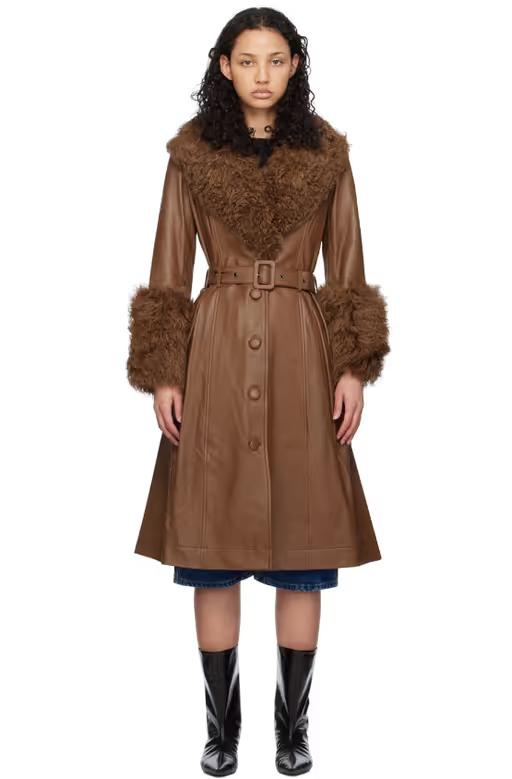 A woman wearing Saks Potts brown foxy shearling coat