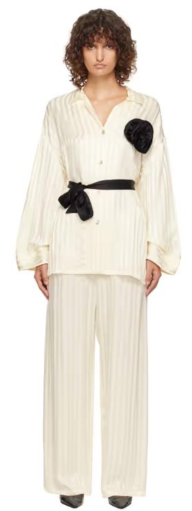 A woman wearing Sleeper off-white rose oversized satin pyjama set