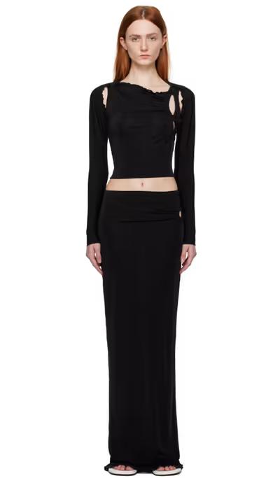 A woman wearing TYRELL ssense exclusive black camisole & midi skirt set
