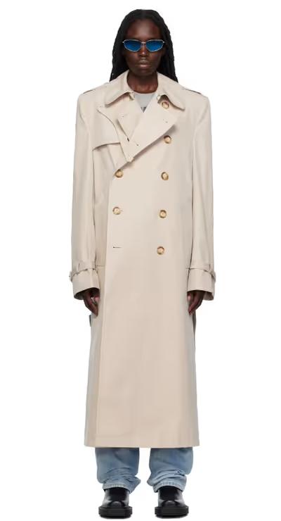 A woman wearing VTMNTS white tailored trench coat