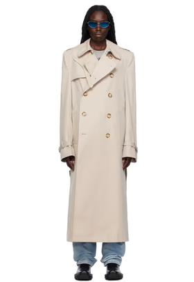 A woman wearing VTMNTS white tailored trench coat