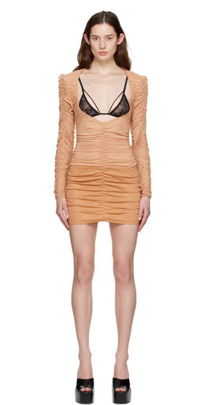A woman wearing Shawna Wu ssense exclusive tan mini dress