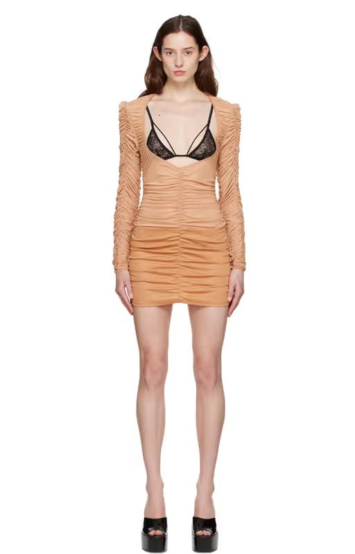A woman wearing Shawna Wu ssense exclusive tan mini dress