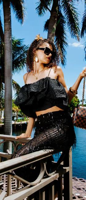 A woman with Sprayground spraysharks worldwide shark handbag