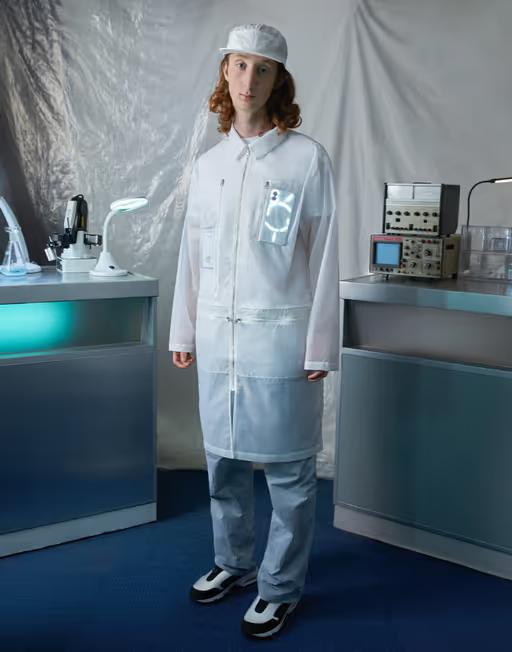 A man wearing Nothing Apparel white labcoat