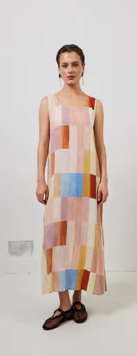A woman wearing cate smock maxi dress patchwork