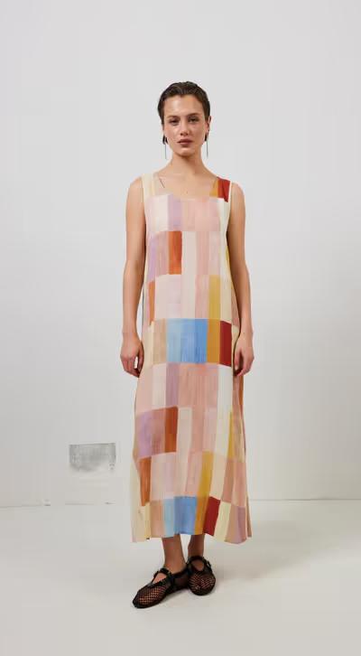 A woman wearing cate smock maxi dress patchwork