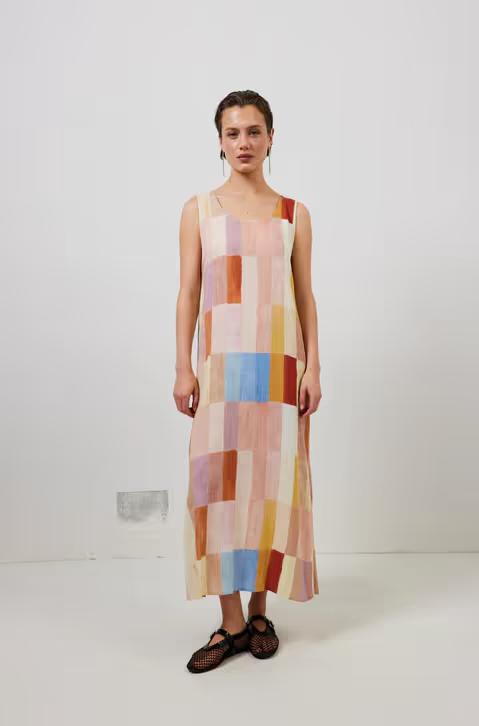 A woman wearing cate smock maxi dress patchwork