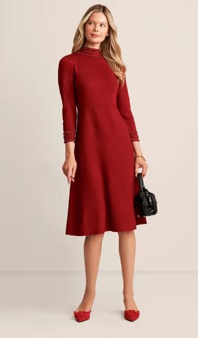 A woman wearing Anne Klein embellished mock neck dress