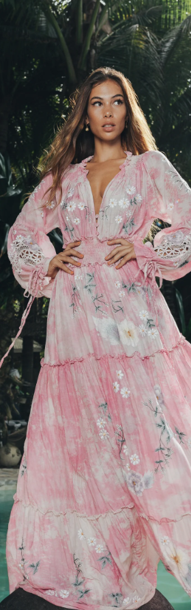 A woman wearing a floral pink Fillyboo dress