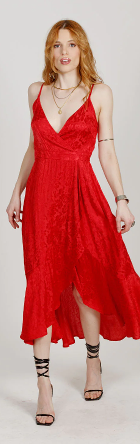 A woman wearing a red Band Of The Free dress and heels