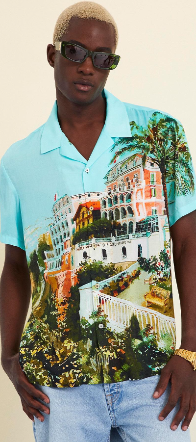 A man wearing a Camilla florida style button up shirt in blue