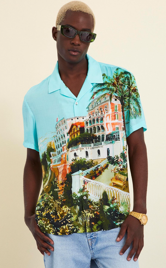 A man wearing a Camilla florida style button up shirt in blue
