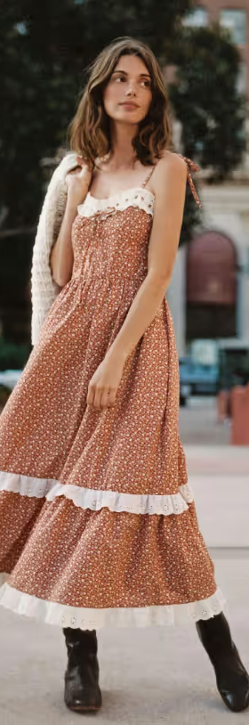 A woman wearing a Christy Dawn dress in red