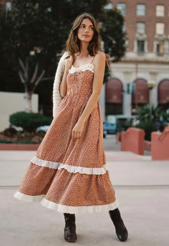 A woman wearing a Christy Dawn dress in red