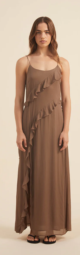 A woman wearing a brown Rove dress