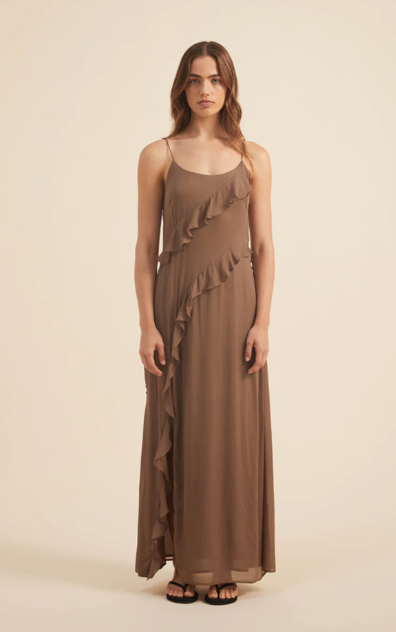 A woman wearing a brown Rove dress